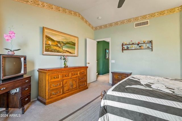 carpeted bedroom with ceiling fan and lofted ceiling