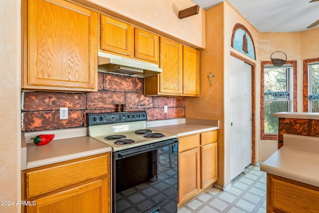 kitchen with tasteful backsplash, ceiling fan, and white electric range oven