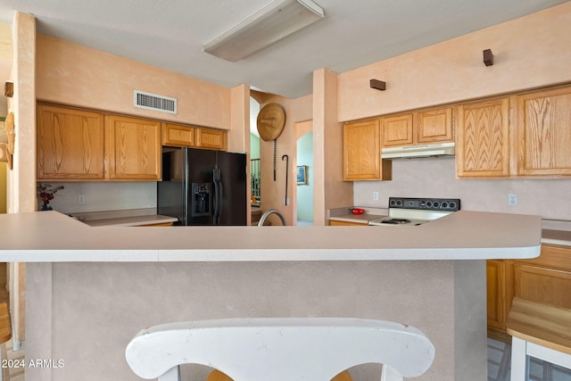 kitchen featuring kitchen peninsula, electric stove, black refrigerator with ice dispenser, and sink