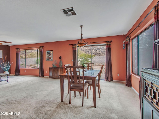 view of carpeted dining space