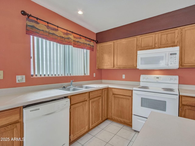 kitchen with sink, light tile patterned floors, and white appliances