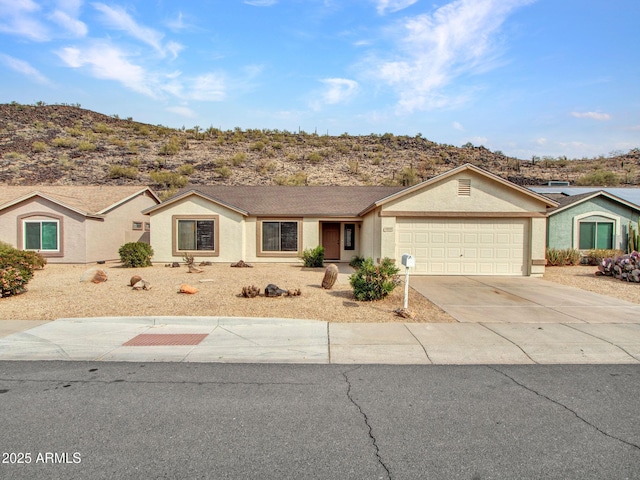 ranch-style home featuring a garage