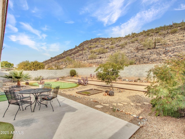 view of patio / terrace featuring a mountain view