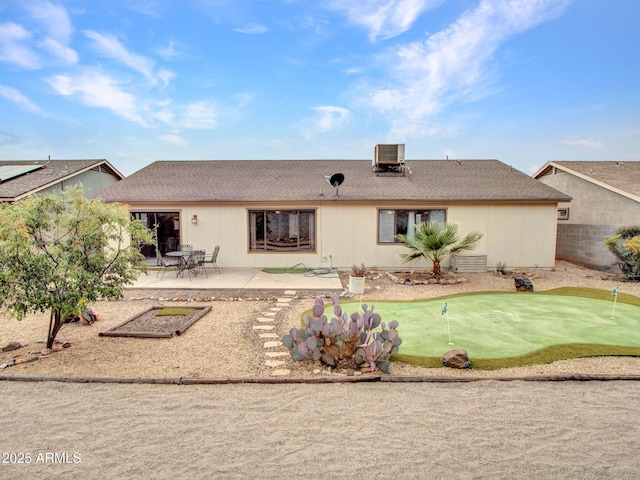 rear view of house featuring cooling unit and a patio