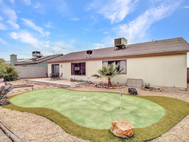 back of property featuring central AC and a patio area