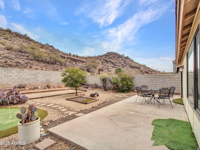 view of patio / terrace featuring a mountain view