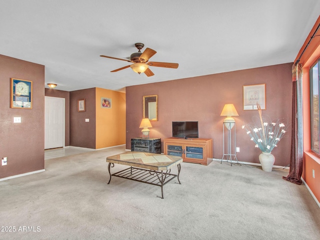 living room featuring light carpet and ceiling fan