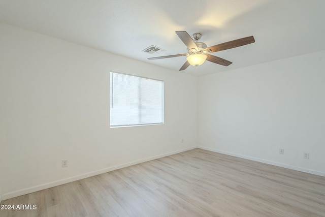 unfurnished room with ceiling fan and light hardwood / wood-style floors