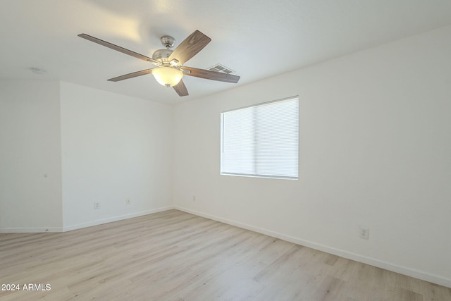 spare room featuring ceiling fan and light hardwood / wood-style flooring