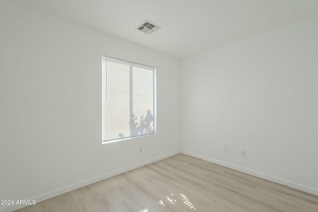 spare room featuring light wood-type flooring