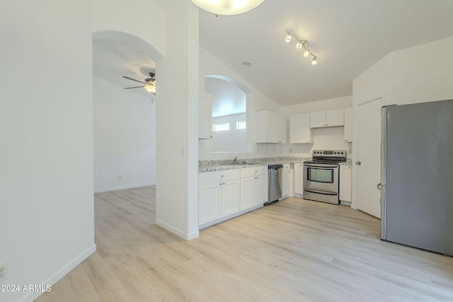 kitchen with white cabinets, light hardwood / wood-style flooring, ceiling fan, appliances with stainless steel finishes, and light stone counters