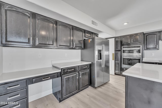 kitchen with stainless steel appliances and light wood-type flooring