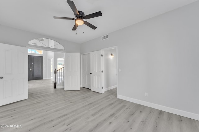 empty room with light hardwood / wood-style flooring and ceiling fan