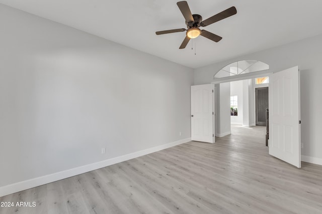 spare room with ceiling fan and light hardwood / wood-style flooring