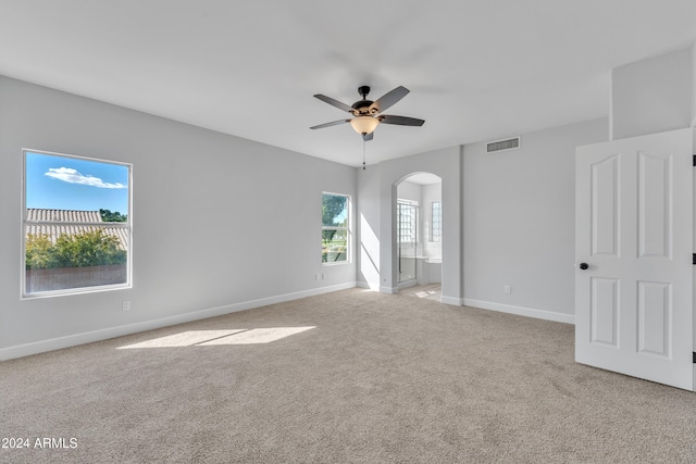 empty room featuring light carpet and ceiling fan