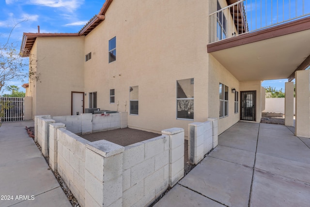 view of side of property featuring a patio