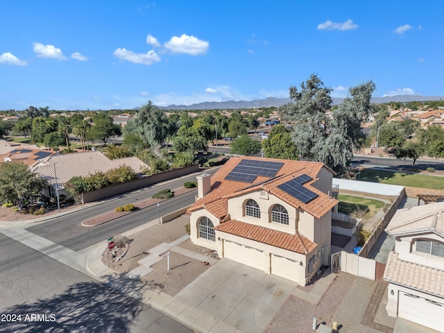 birds eye view of property featuring a mountain view