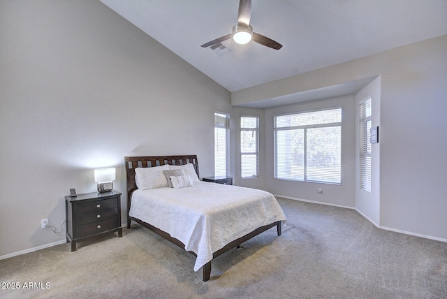 bedroom featuring vaulted ceiling, light colored carpet, and ceiling fan