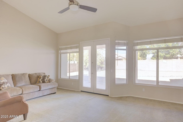 carpeted living room featuring french doors, ceiling fan, plenty of natural light, and vaulted ceiling