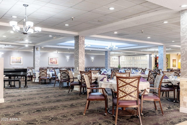 dining space with carpet floors and a chandelier