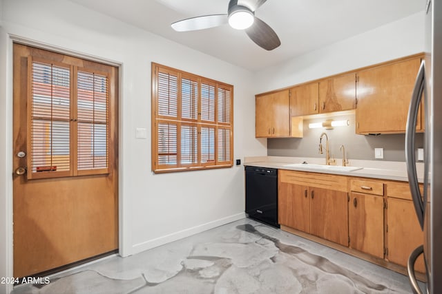 kitchen featuring stainless steel refrigerator, sink, black dishwasher, and ceiling fan