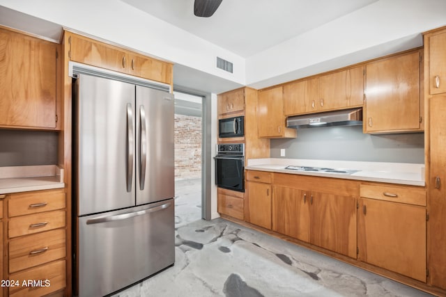 kitchen with extractor fan, black appliances, and ceiling fan