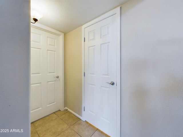 8022 S 48th Dr, Laveen, AZ 85339 - hallway featuring light tile patterned flooring and baseboards
