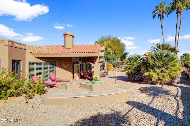 back of house featuring a patio