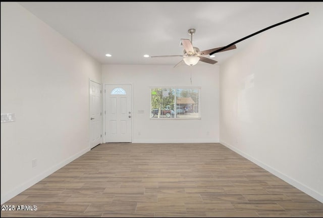 foyer entrance featuring baseboards, recessed lighting, light wood-style floors, and a ceiling fan
