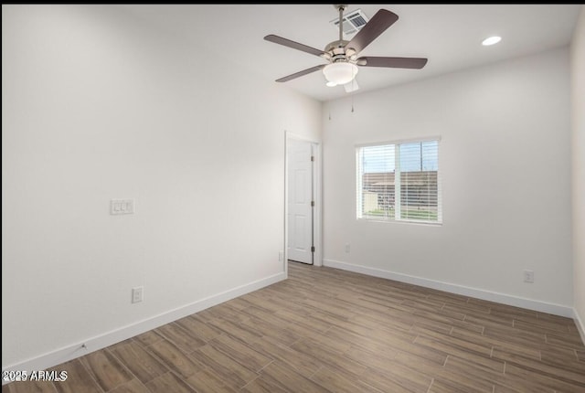 unfurnished room featuring a ceiling fan, wood finished floors, baseboards, visible vents, and recessed lighting