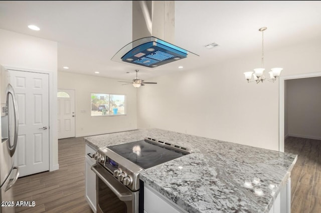 kitchen with visible vents, wood finished floors, recessed lighting, appliances with stainless steel finishes, and ceiling fan with notable chandelier