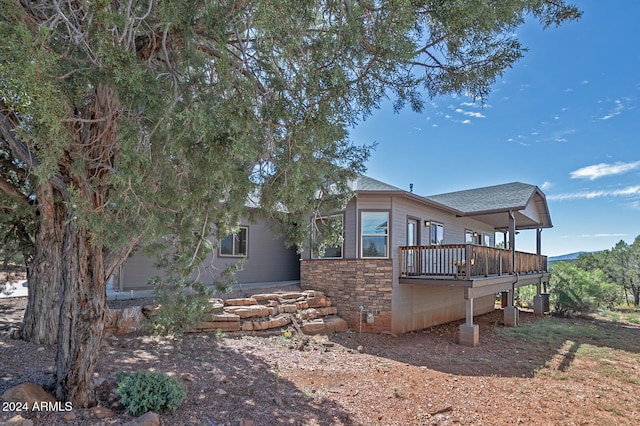 rear view of property with a deck