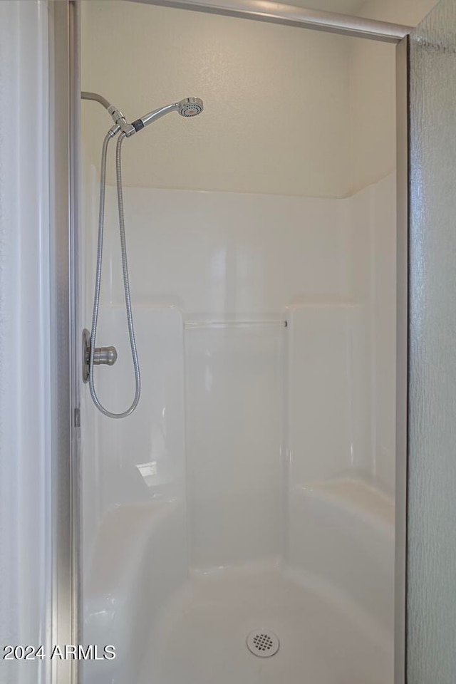 bathroom featuring walk in shower