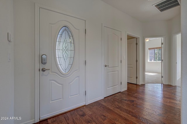 entryway with dark hardwood / wood-style floors