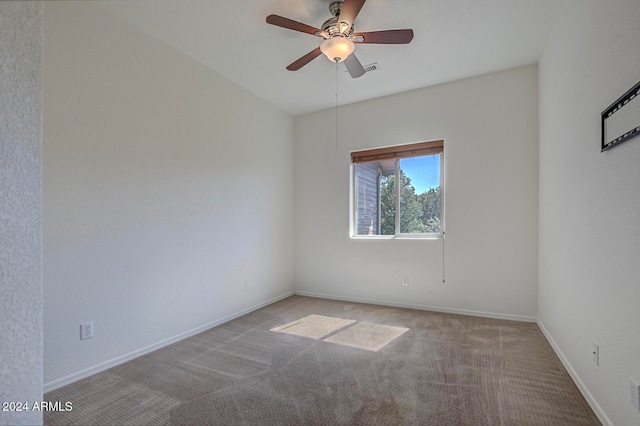 carpeted empty room featuring ceiling fan