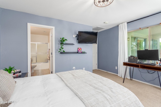 carpeted bedroom with ensuite bathroom