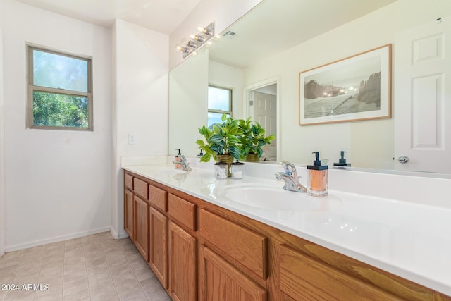 bathroom featuring tile patterned floors and vanity