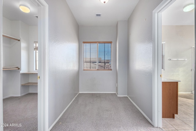 corridor with light carpet