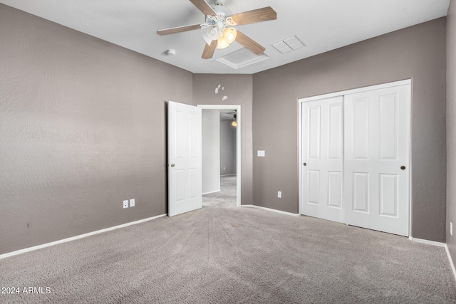 unfurnished bedroom with a closet, carpet, and ceiling fan