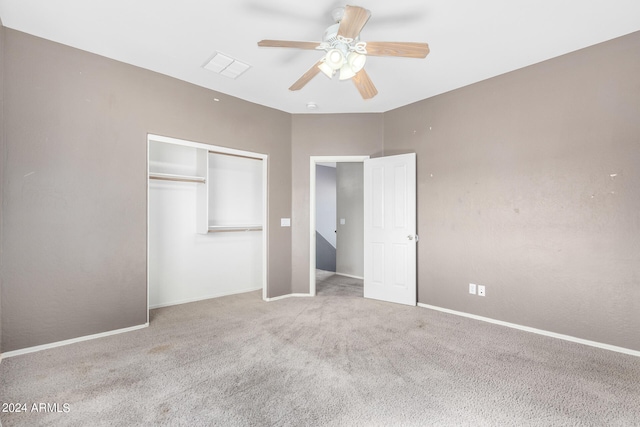 unfurnished bedroom featuring ceiling fan and light colored carpet