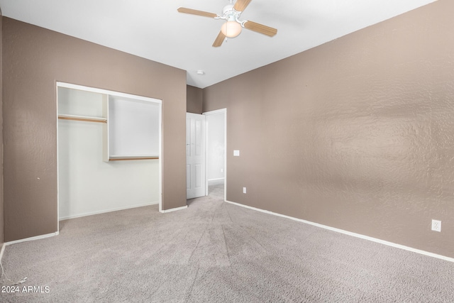 unfurnished bedroom featuring a closet, carpet flooring, and ceiling fan