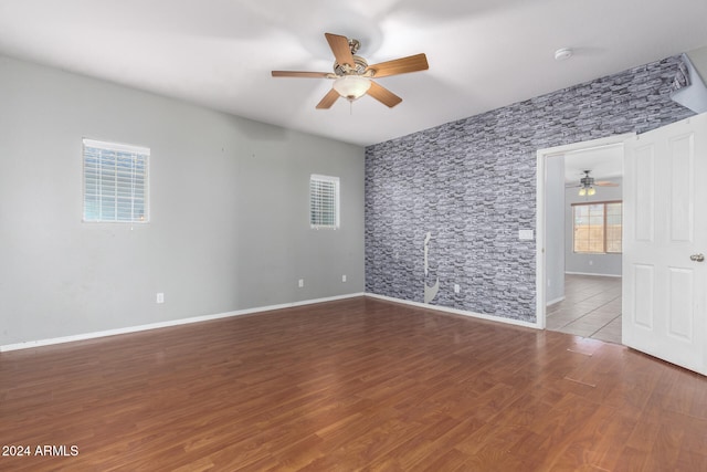 spare room featuring hardwood / wood-style floors and ceiling fan