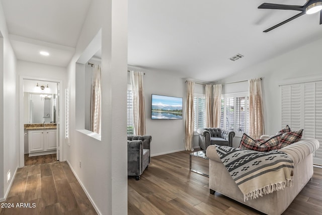 living room featuring ceiling fan, dark hardwood / wood-style flooring, and lofted ceiling