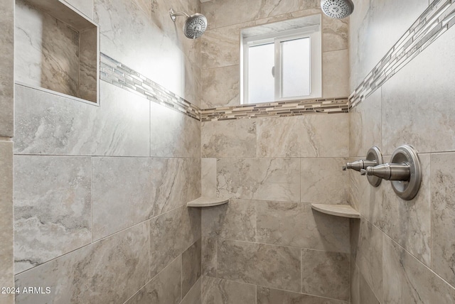 interior space featuring a tile shower