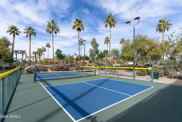 view of sport court featuring basketball hoop