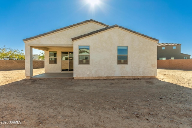 rear view of house featuring a patio