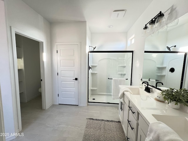 bathroom featuring toilet, walk in shower, and vanity