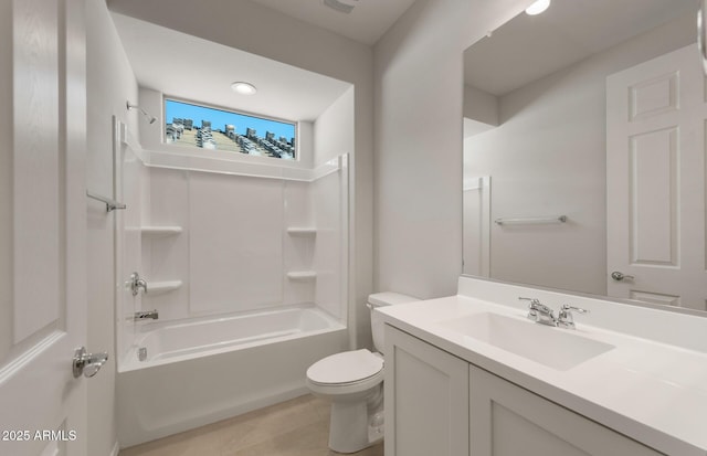 full bath featuring bathing tub / shower combination, vanity, and toilet