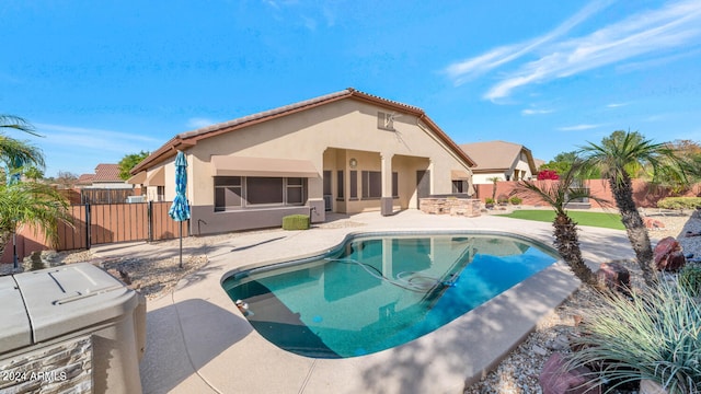 view of swimming pool with a patio