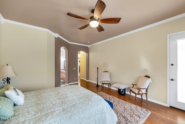 bedroom featuring ceiling fan, crown molding, and hardwood / wood-style flooring